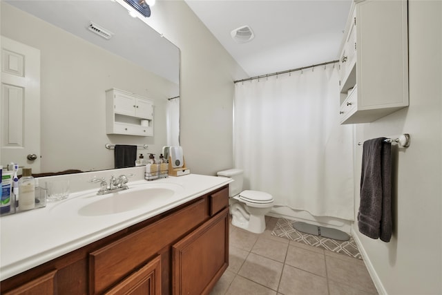 bathroom featuring curtained shower, vanity, toilet, and tile patterned floors