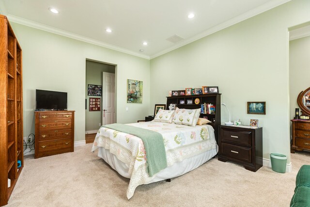 carpeted bedroom featuring crown molding