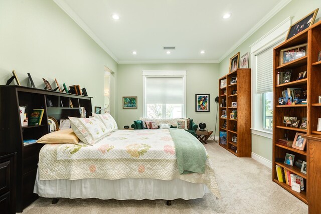 carpeted bedroom with ornamental molding