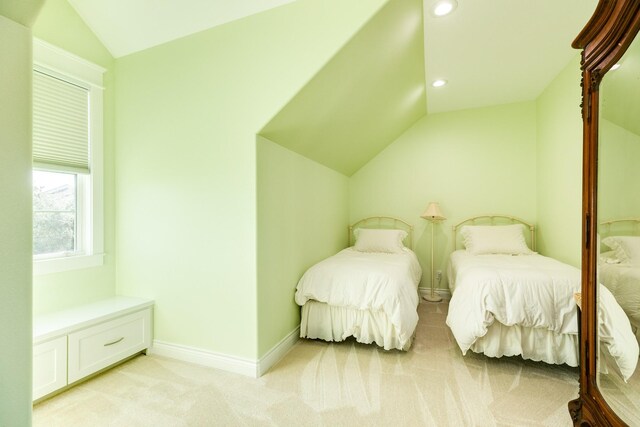 53 Island Psge, Galveston, TX 77554 - bedroom featuring light carpet, baseboards, lofted ceiling, and recessed lighting