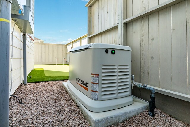 53 Island Psge, Galveston, TX 77554 - details featuring board and batten siding, a power unit, and fence