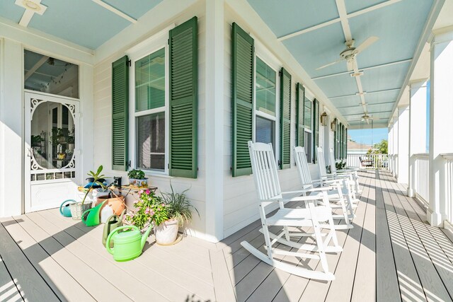 wooden deck with ceiling fan and a porch