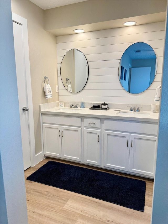 bathroom featuring vanity and hardwood / wood-style flooring