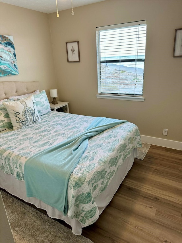 bedroom with hardwood / wood-style flooring