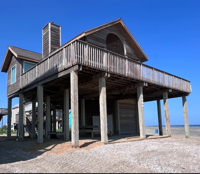 exterior space with a deck with water view