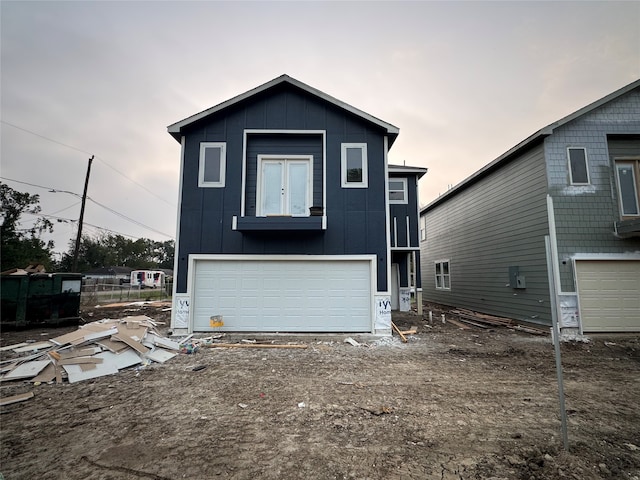 back of house with a garage