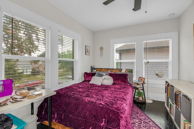 bedroom featuring ceiling fan and dark wood-type flooring