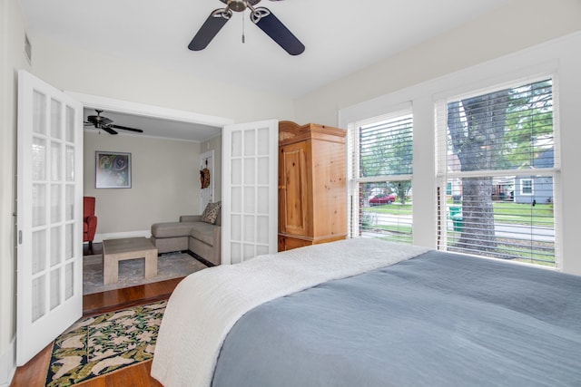 bedroom featuring ceiling fan and hardwood / wood-style floors