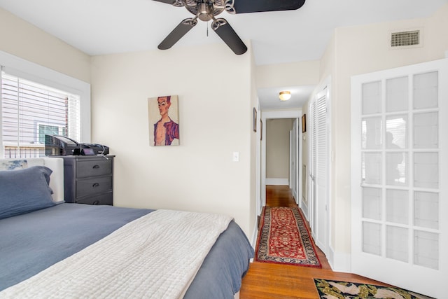 bedroom featuring a closet, ceiling fan, and hardwood / wood-style floors