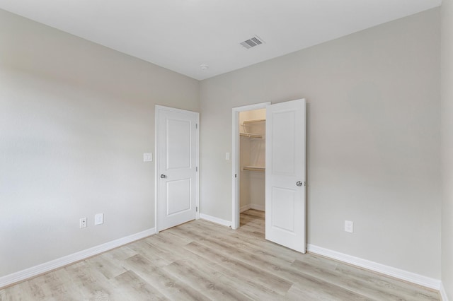 spare room featuring light wood-type flooring