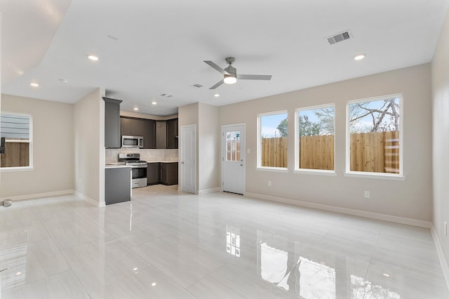 unfurnished living room featuring ceiling fan