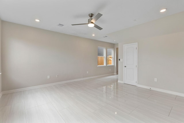 spare room featuring ceiling fan