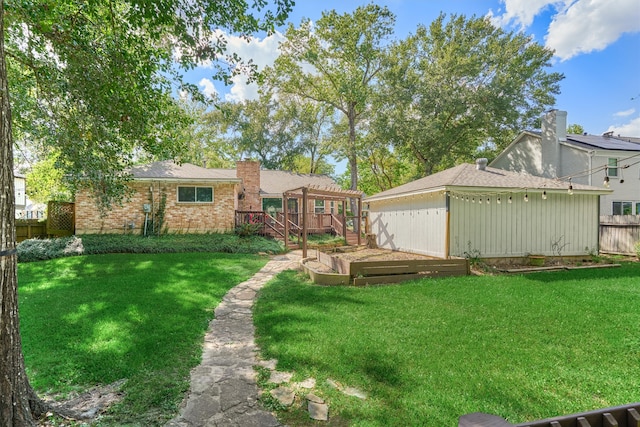 view of yard featuring a wooden deck