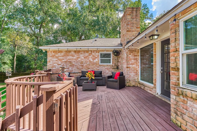 wooden terrace featuring outdoor lounge area