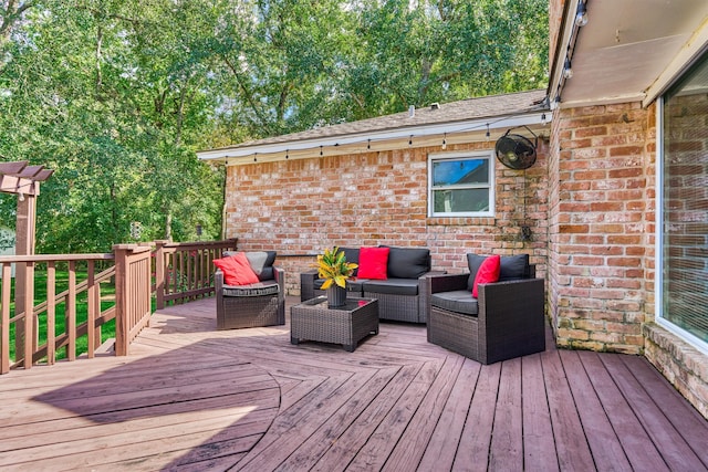 wooden terrace featuring an outdoor hangout area