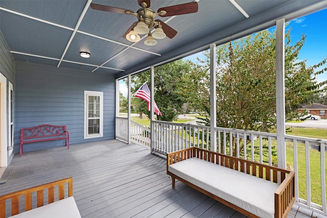 deck with ceiling fan and a porch