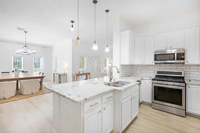 kitchen with white cabinetry, stainless steel appliances, and a wealth of natural light