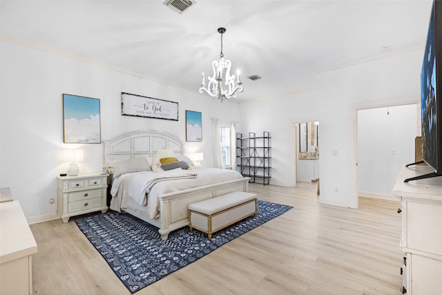 bedroom featuring light hardwood / wood-style floors, an inviting chandelier, and ornamental molding