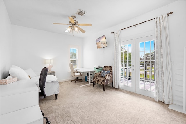 carpeted bedroom with french doors, access to outside, and multiple windows