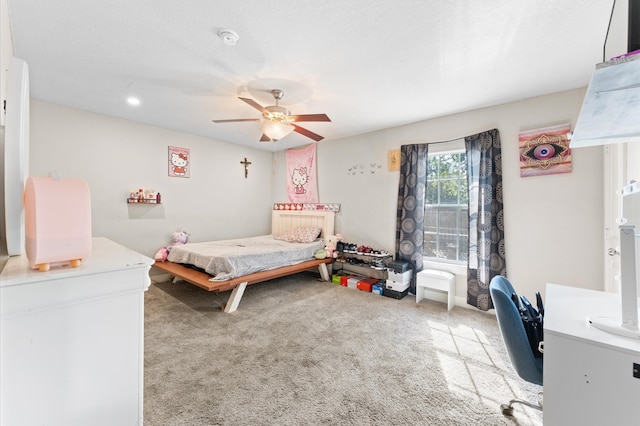 carpeted bedroom featuring ceiling fan