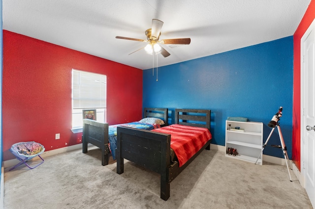 bedroom featuring ceiling fan and carpet