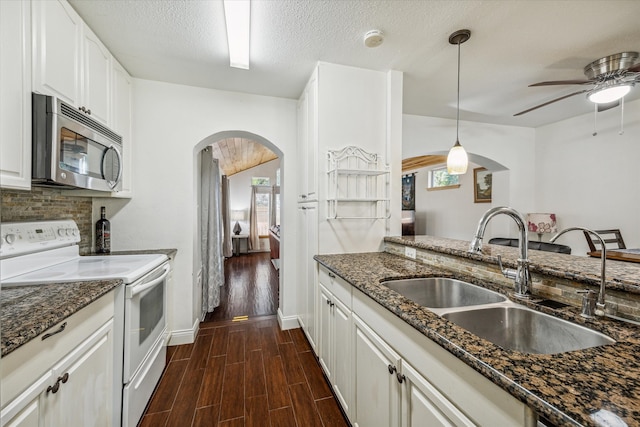 kitchen featuring sink, white electric range, white cabinets, and dark hardwood / wood-style flooring