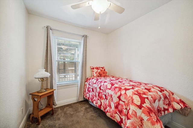 bedroom featuring dark carpet and ceiling fan