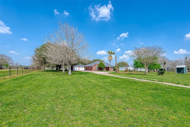 view of yard with a storage shed