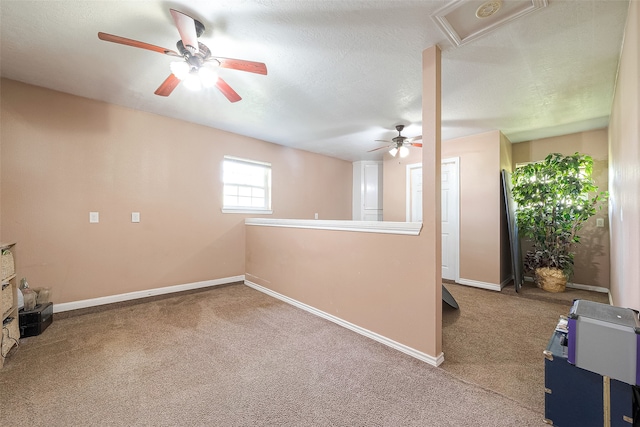 interior space featuring ceiling fan and a textured ceiling