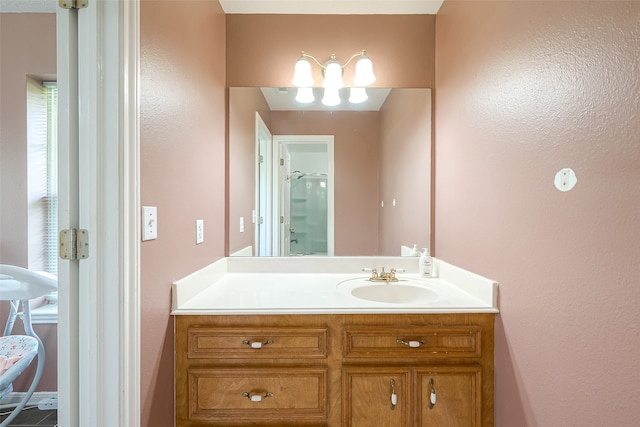 bathroom with a shower and vanity