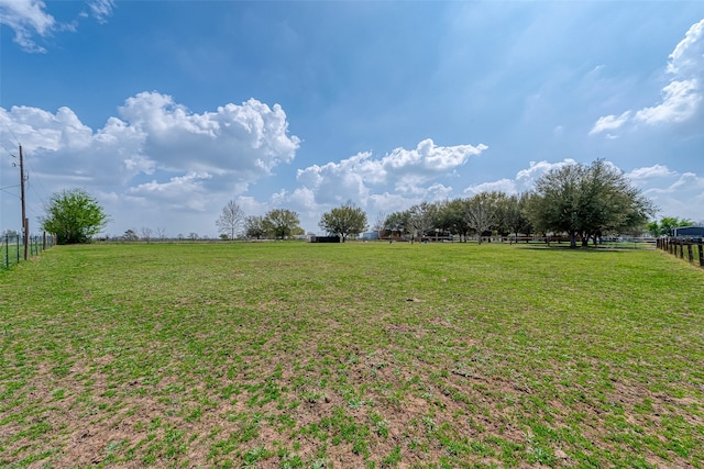 view of yard with a rural view