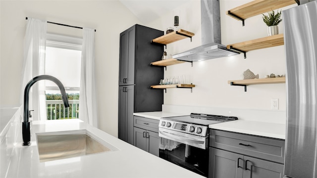 kitchen featuring island range hood, appliances with stainless steel finishes, sink, and gray cabinetry