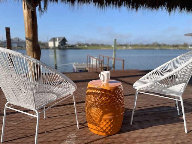 wooden deck featuring a water view