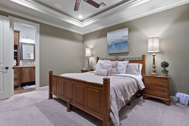 bedroom featuring light colored carpet, crown molding, ceiling fan, and ensuite bathroom