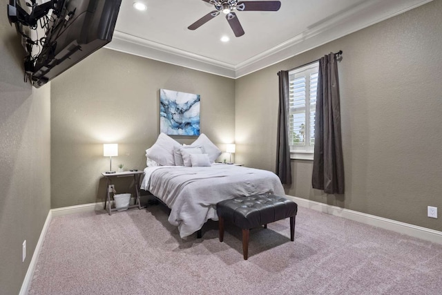 carpeted bedroom featuring ceiling fan and ornamental molding