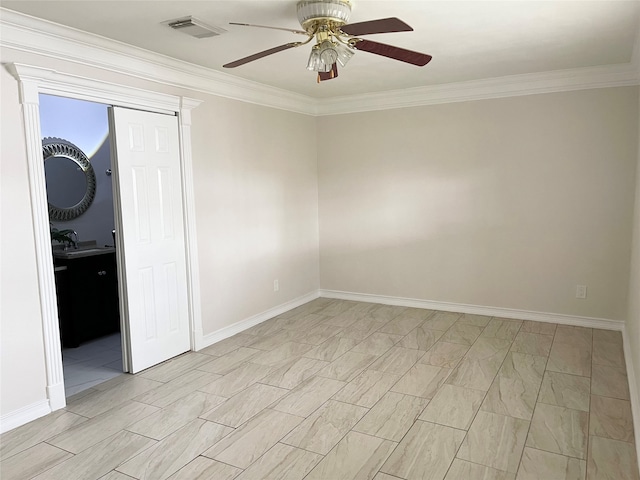 empty room featuring ornamental molding, sink, and ceiling fan