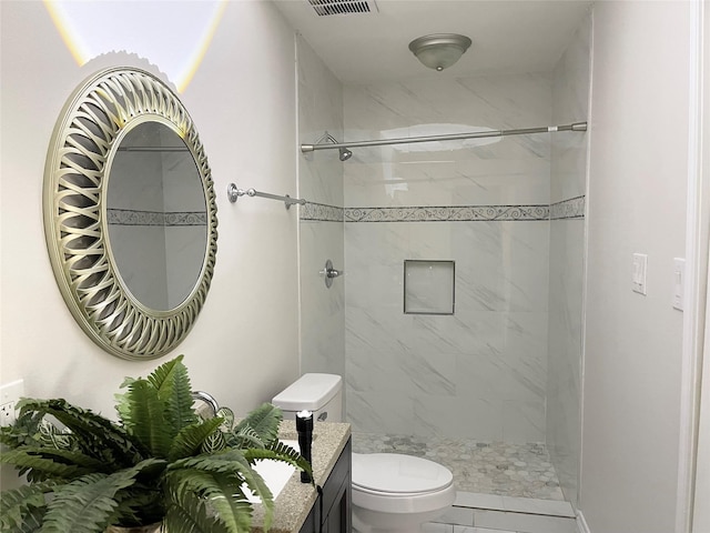 bathroom with vanity, walk in shower, visible vents, and toilet