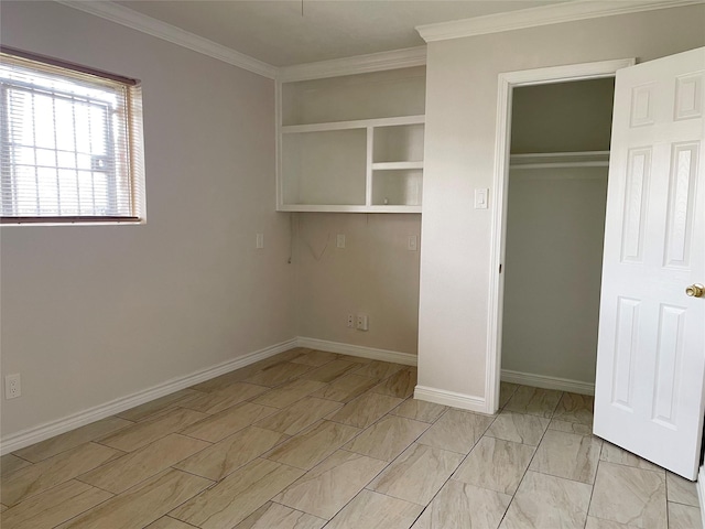 unfurnished bedroom featuring crown molding, baseboards, and a closet