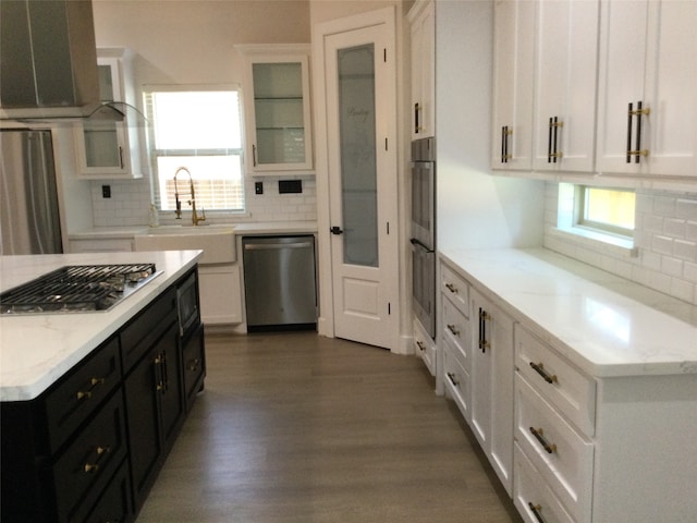 kitchen featuring white cabinets, backsplash, dark hardwood / wood-style flooring, stainless steel appliances, and sink