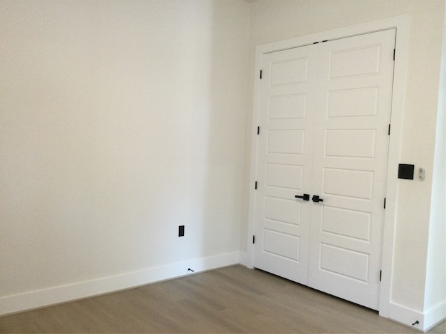 spare room featuring light hardwood / wood-style floors