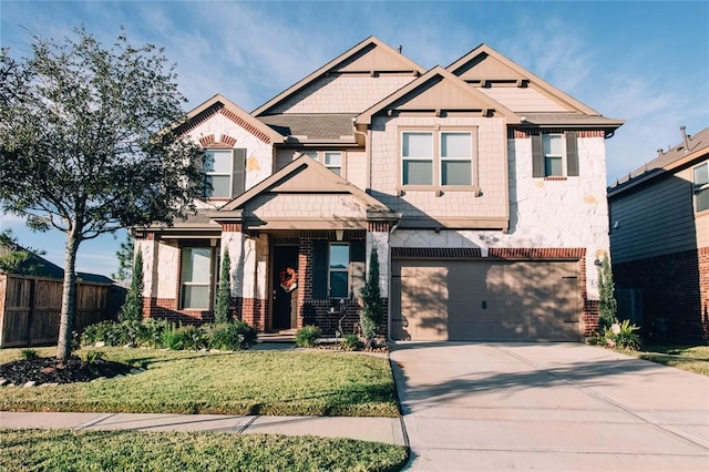 craftsman-style home with a garage and a front yard