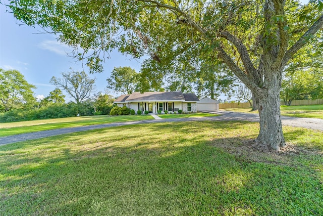 single story home featuring a front yard