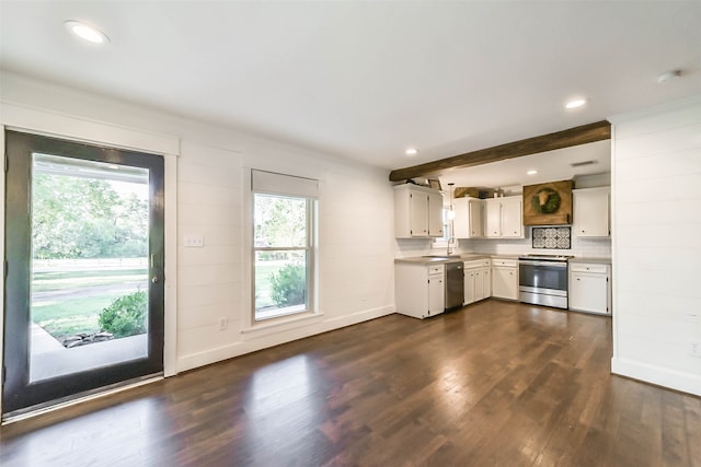 kitchen with plenty of natural light, dark wood-type flooring, stainless steel appliances, and white cabinets