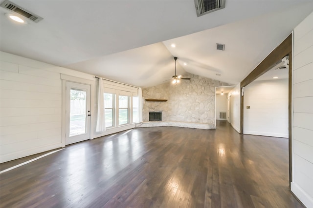 unfurnished living room featuring ceiling fan, a fireplace, vaulted ceiling, and dark hardwood / wood-style flooring