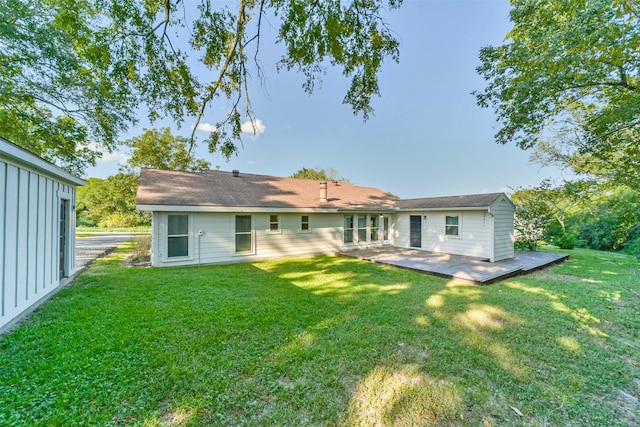 back of house featuring a lawn and a patio area