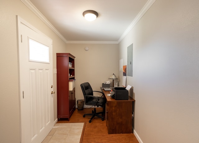 home office featuring ornamental molding, electric panel, and light hardwood / wood-style flooring