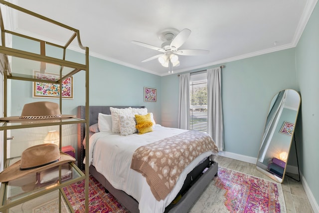 bedroom with light hardwood / wood-style floors, ornamental molding, and ceiling fan