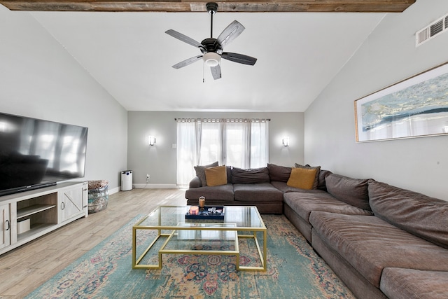 living room featuring beam ceiling, high vaulted ceiling, light wood-type flooring, and ceiling fan