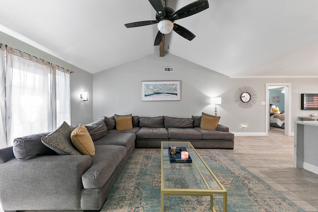 living room featuring light hardwood / wood-style floors, vaulted ceiling with beams, and ceiling fan