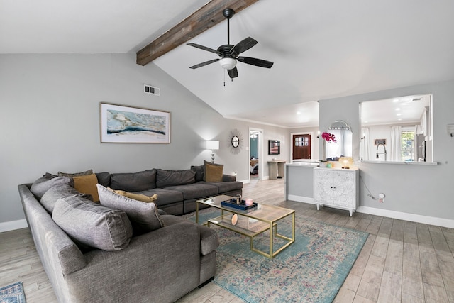 living room with vaulted ceiling with beams, hardwood / wood-style flooring, and ceiling fan